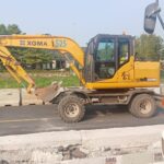 Excavator ban mini untuk pemasangan utilitas bawah tanah